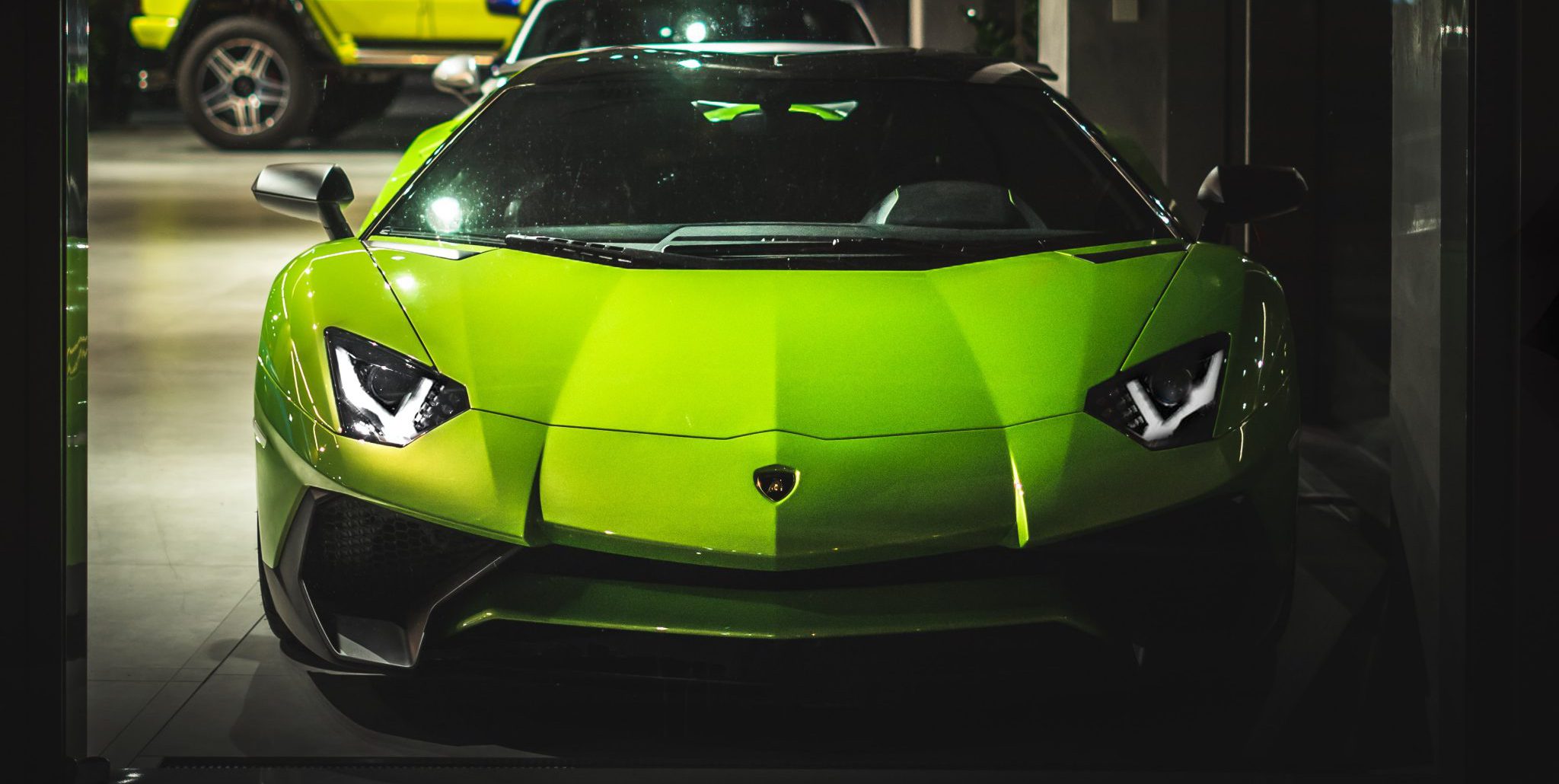 head on view of a parked green lamborghini