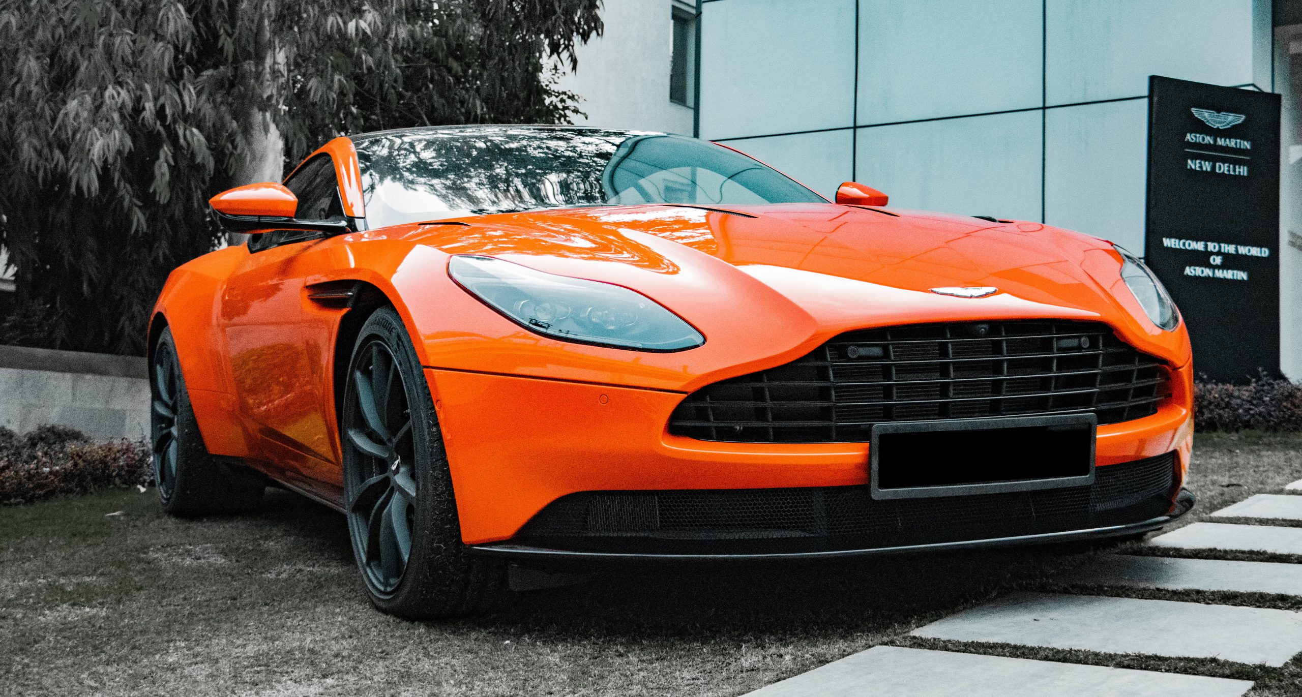 parked sports car with a sparkling orange finish